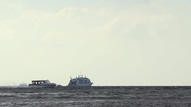 Passenger Boat Cruises Past at High Speed in the Maldives