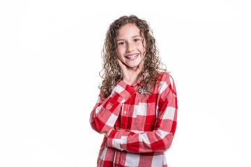 Portrait of 9 years old girl with curly hair, isolated on white