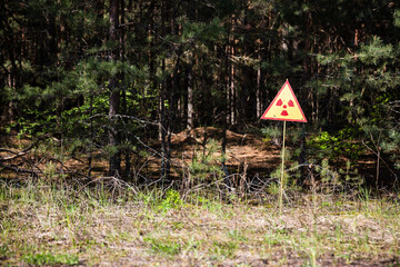 radioactive warning sign at the red forest in chernobyl	