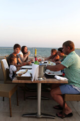 Family in the beach restaurant