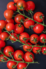 Cherry tomatoes on a black background