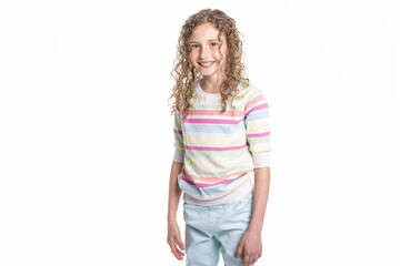 Portrait of happy, smiling, confident 9 years old girl with curly hair, isolated on white