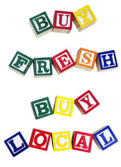 BUY FRESH BUY LOCAL concept spelled with colorful toy alphabet blocks. Isolated.