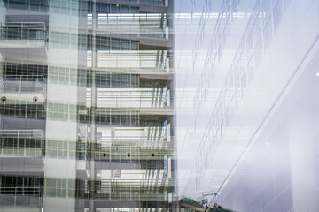 Reflections on abstract curtain wall in modern office building