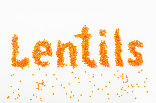 Fototapeta Red lentils inscription on white