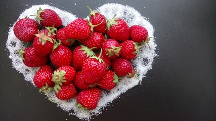 Strawberries lie in the shape of the heart