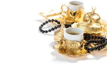 Obraz na płótnie Canvas Golden coffee cups rosary Islamic holidays Ramadan kareem