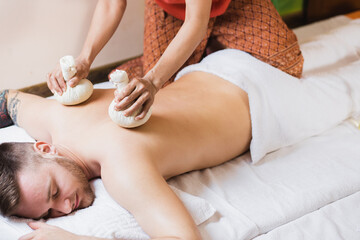 man engaged in Ayurvedic spa treatment