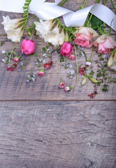 Festive flower composition on the white wooden background. Overhead view.