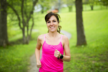 Fototapeta premium portrait of a woman jogging outdoors