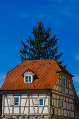 Residential tudor style house with blue sky in background
