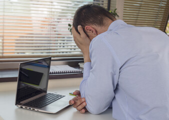 Stressed tired business man suffering from a headache isolated on white background