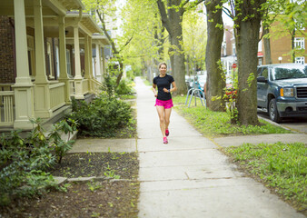 portrait of a woman jogging outdoors