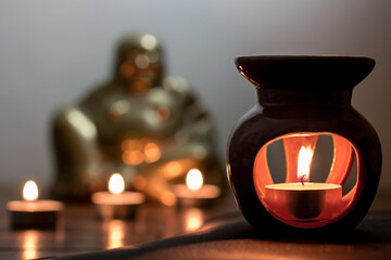 Close up fairy / tealight candles and incense burner 