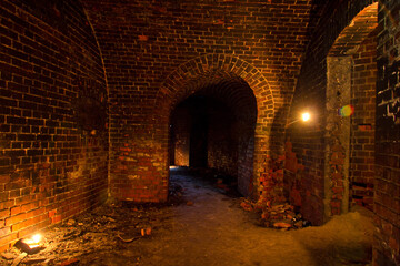 Dungeon under the old Prussian fortress illuminated by candles, Kaliningrad