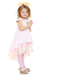 The boy gives the girl a flower.