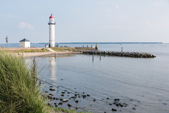 The historical white lighthouse at the Haringvliet in Hellevoetsluis in the Netherlands.