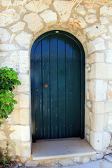 Old door in stone wall