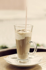 Coffee with cream in a cafe, vintage food background for menu in a cafe