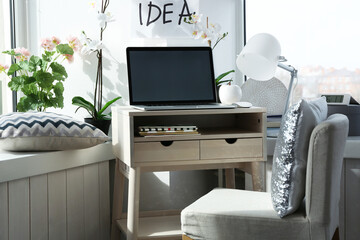 Creative workplace near windowsill in modern room