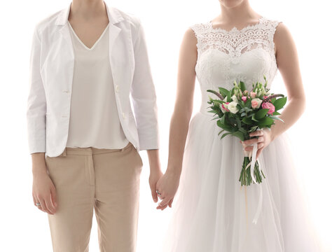 Gay wedding concept. Happy married lesbian couple on white background