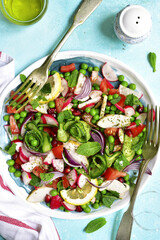 Summer colorful vegetable salad with chicken and mint.Top view.