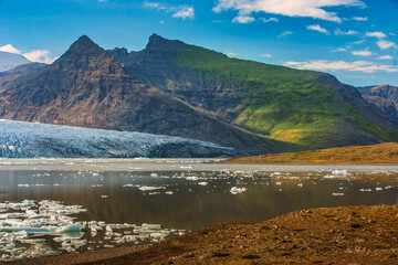 Beautiful view of icebergs in Jokulsarlon glacier lagoon, Iceland, global warming concept, selective focus