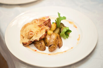 Potatoes baked meat cheese