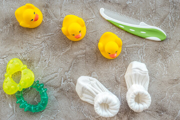 baby shower decoration for birth of child celebration on gray background top view