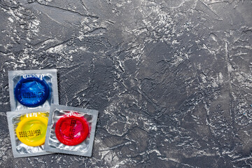 safe sex with condom contraception on dark background top view mock up