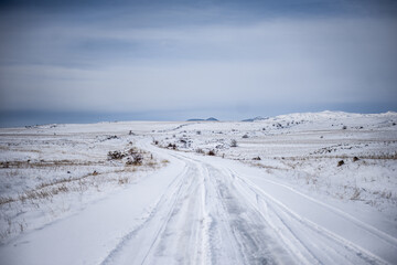 Fototapeta na wymiar Snowy winter road