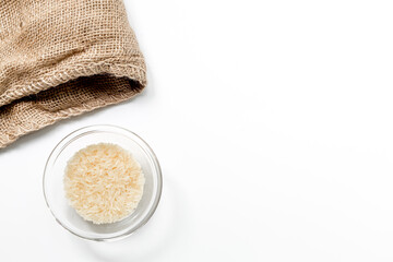 rice in plate with napkin for paella on white desk background top view mock-up