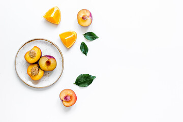 orange and peach summer sweet dessert on plates white background top view mock-up