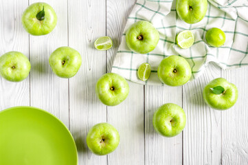 summer food with green apples on white background top view