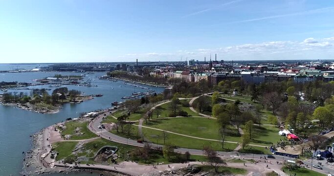 Kaivopuisto, Cinema 4k aerial view of a flight around brunnsparken, on a sunny summer day, in Helsinki, Finland