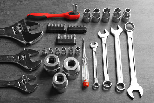 Setting of tools for car repair on grey table
