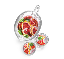 Jug and glasses of refreshing lemonade with red orange on white background
