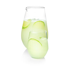 Jug and glass of refreshing lemonade on white background