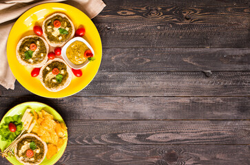 tasty and delicious bruschetta with avocado, tomatoes, cheese, herbs, chips and liquor, on a wooden background.