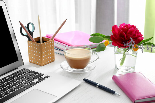 Fototapeta Beautiful fragrant flowers as floral decoration on workplace