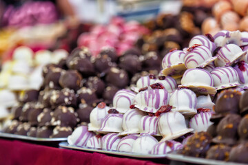 Assortment of sweet confectionery with colorful chocolate candies on budapest streets in Hungary. Selective focus image