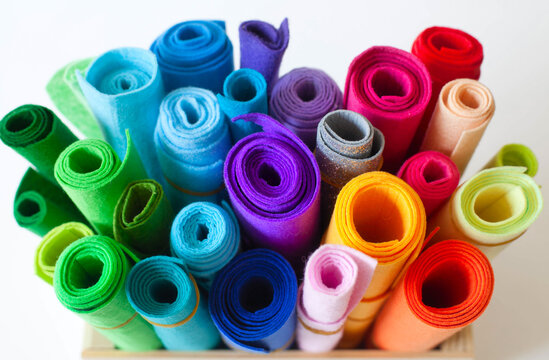 Felt Craft color. Rolls of felt lay on a white background. Jute rope.