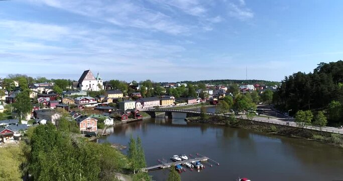Porvoo, Cinema 4k aerial rising view of porvoonjoki and old town in Borg&aring;, Uusimaa, Finland