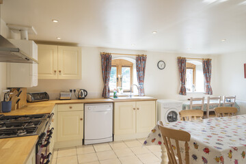 Brightly-Lit Furnished Kitchen Interior and Dining Area