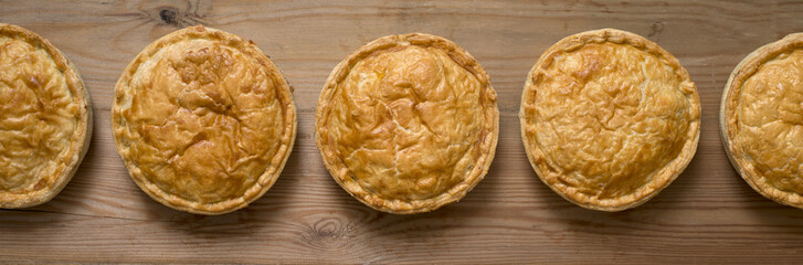 Panorama of Cooked Whole Round Meat Pies