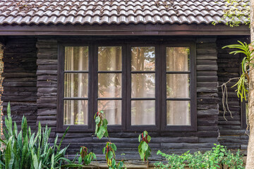 Retro wooden window and wall. The old house in Thailand.