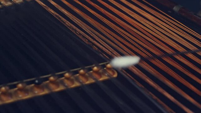 Folk musical instrument. Male hand hold stick and hit strings cimbalom. String instruments background. Cimbalom music playing. Music player playing cimbalom music. Hammered dulcimer playing