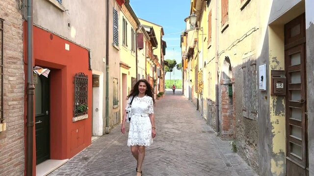 mature  tourist  hiking in alleyways in Italy