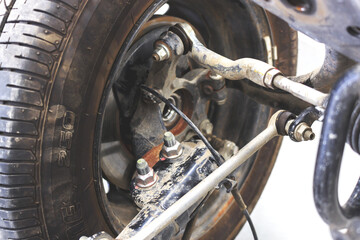 closeup wheels and shock absorbers with repair the suspension on the car. soft-focus and over light