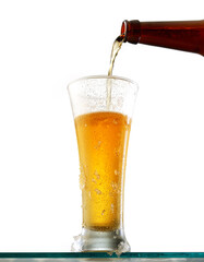 Glass of cold beer on a white background